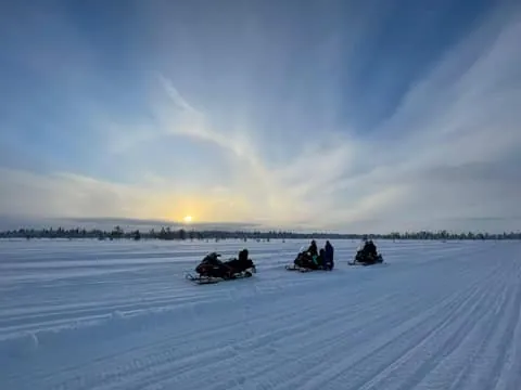 Ylläs: Snowmobile trip in a forest with a small group