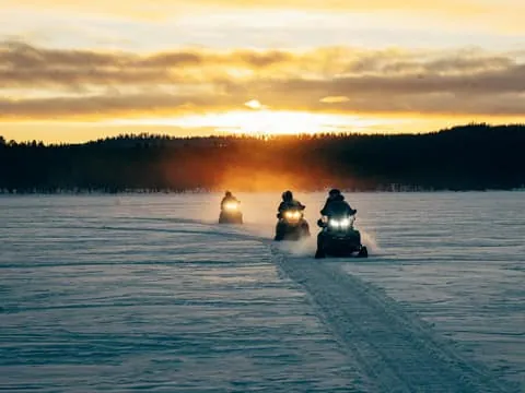 Explore Lake Inari by Snowmobile