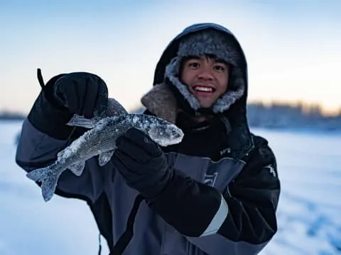 Ice Fishing on a Frozen Lake with BBQ and Photos