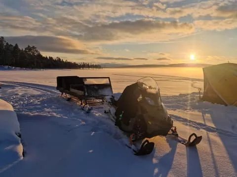 Snowmobile-pulled sleigh ride, fishing & lunch by the fire