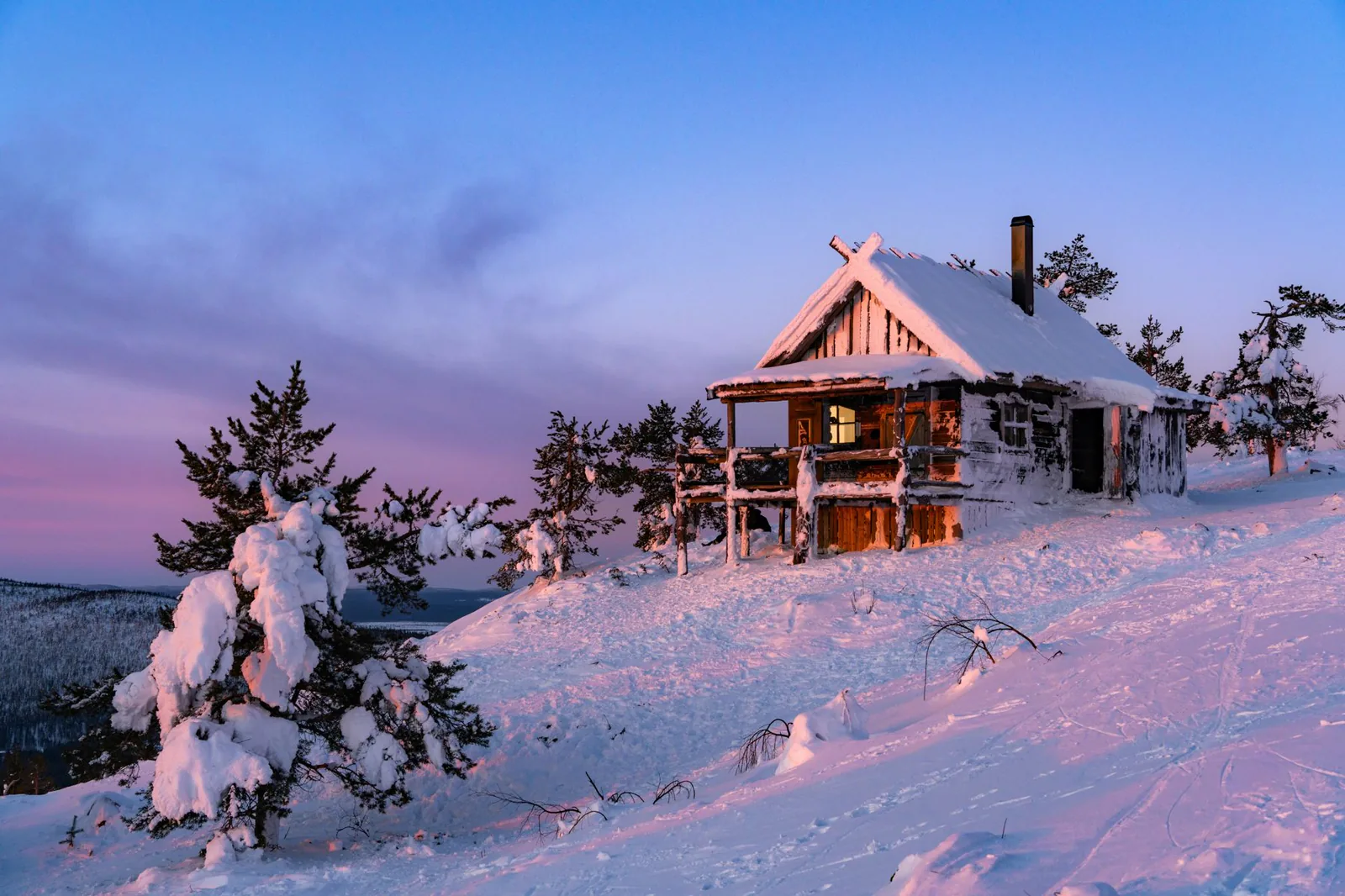Log cabin on the fell above Levi at dusk